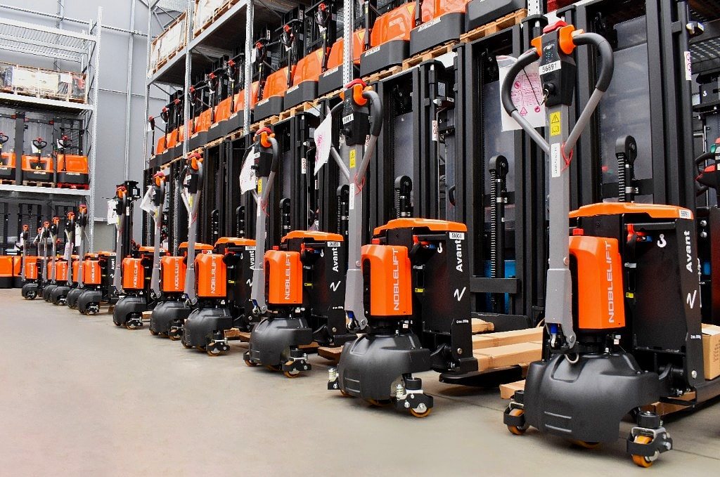 Row of Noblelift Avant pallet trucks in the warehouse